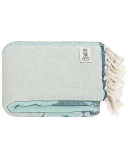 Folded towel with tassels on a white background