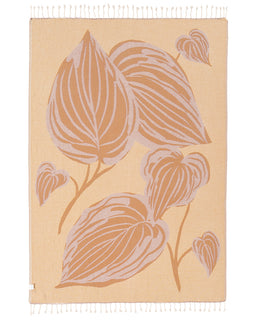 Reverse side of the leaf print blanket, shown in cream with taupe and mustard leaves.