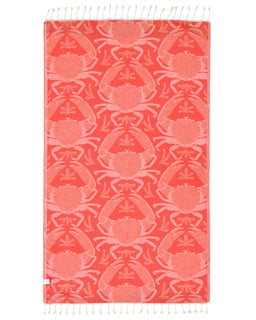 Red towel with crab pattern on a white background