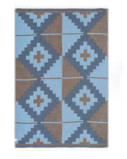 blanket with blue and brown geometric pattern on a white background