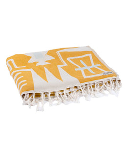 Yellow and white patterned blanket with fringes on a white background
