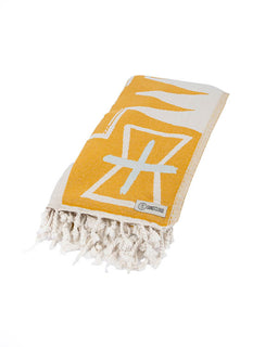 Yellow and white towel with geometric design on a white background