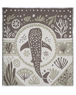Blanket with whale shark design and underwater pattern on a brown background