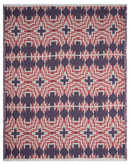 Geometric patterned blanket with red, blue, and white colors