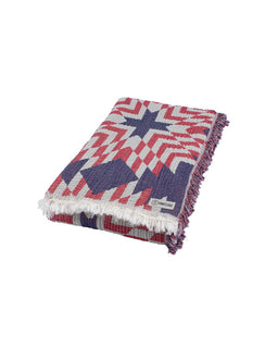 Woven blanket with geometric pattern on a white background