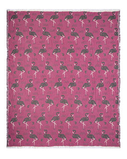 Pink blanket with black and white pattern of flamingo on a white background