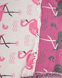 Textile with pink flamingo pattern on a white background