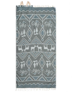 Towel with nature-themed design featuring mountains, trees, and deer on a white background
