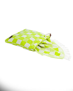 Green and white checkered towel with fringes on a white background