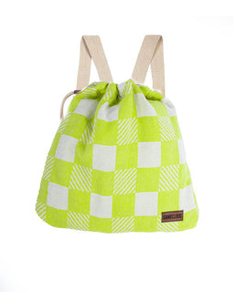 Green and white checkered drawstring bag with beige straps on a white background