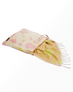 Folded fabric with pink and yellow pattern on a white background