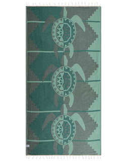 Towel with turtle design on a green and gray background