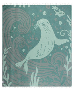 Teal blanket with seal design and underwater patterns on a white background