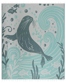 Towel with a seal design and underwater elements on a light blue and gray background
