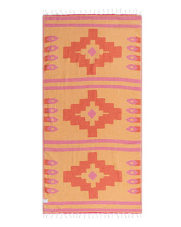 Yellow towel with red and pink geometric patterns on a white background