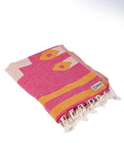 Pink and orange towel with geometric patterns on a white background