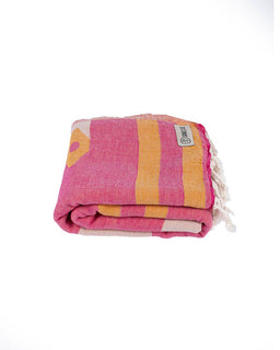 Pink and yellow striped towel with tassels on a white background