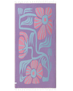 Floral patterned towel with pink and blue flowers on a purple background
