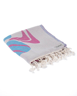 Folded towel with pink and blue abstract design on a white background