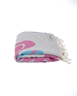 Folded towel with floral design on a white background