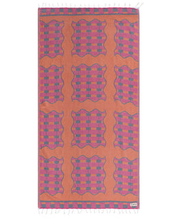 Patterned towel with pink and blue designs on an orange background