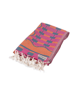 Colorful towel with geometric pattern and tassels on a white background