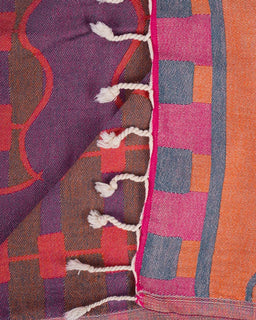 Close-up of a colorful woven textile with geometric patterns