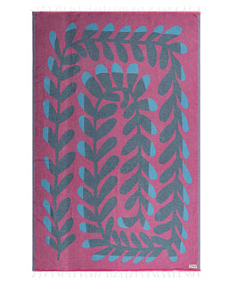 Pink towel with blue leaf pattern on a white background