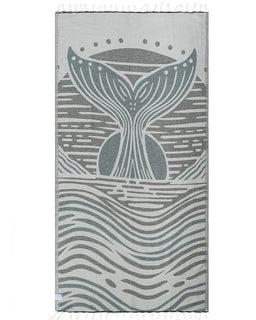 Towel with whale tail design on a white background
