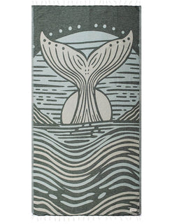 Towel with whale tail design on a gray background