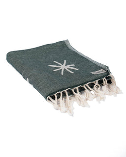 Grey towel with white star design and fringes on a white background