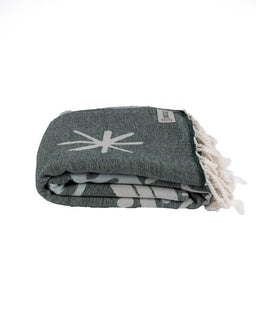 Gray patterned blanket with tassels on a white background