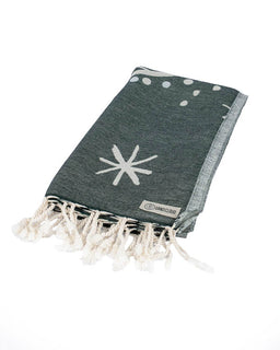 Gray towel with white star pattern and tassels on a white background