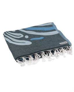 Blue and gray towel with white tassels on a white background