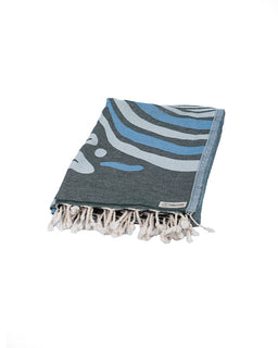 Blue and gray patterned towel with tassels on a white background