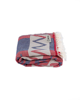 Folded blanket with a pattern on a white background