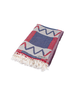Folded towel with geometric pattern on a white background