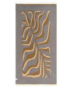 Gray towel with brown abstract leaf pattern on a white background