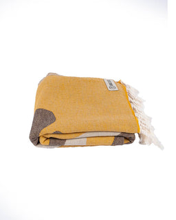 Yellow towel with brown and white accents on a white background