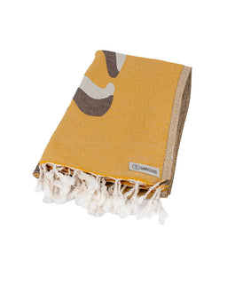 Yellow towel with fringe and logo on a white background