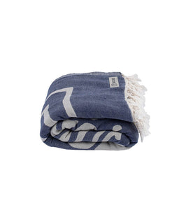 Folded blue towel with white fringe and logo on a white background