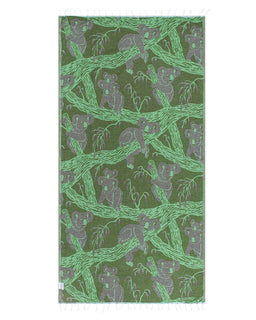 Green towel with bear and branch pattern on a white background