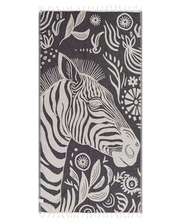 Towel with zebra design and floral patterns on a dark background