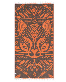 Decorative towel with cheetah design in orange on a brown background
