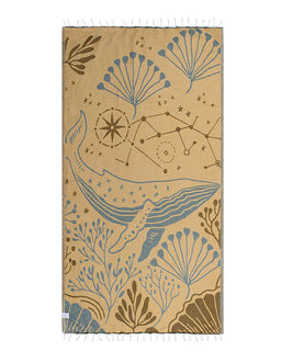 Towel with whale and nature pattern on a beige background