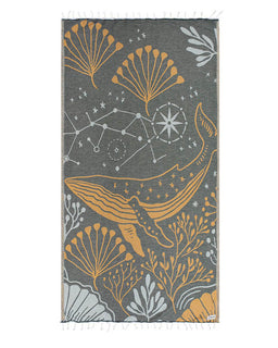Towel with whale and star pattern on gray background