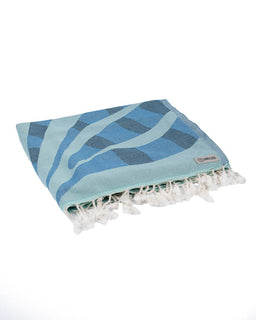 Blue and white patterned towel with tassels on a white background