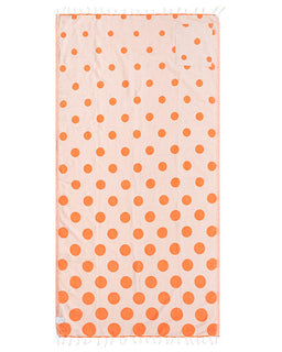 Beige towel with orange polka dots on a white background