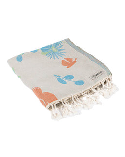 Beige towel with floral patterns and tassels on a white background