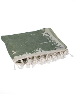 Green and white patterned towel with tassels on a white background